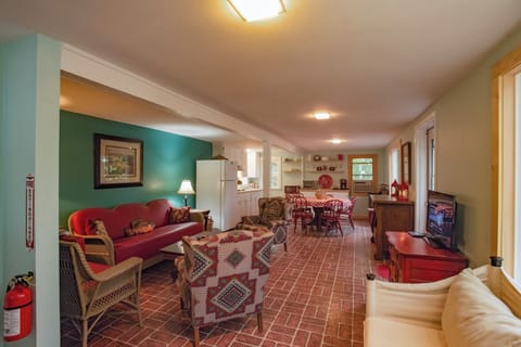 Lower-Level Living Area with TV and the Second Kitchen in the Background