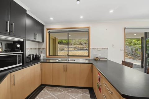 Thoughtfully set up kitchen with essential cookware and appliances.