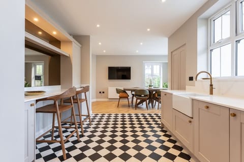 Fully equipped modern kitchen diner with breakfast bar