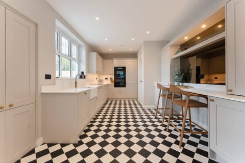 Fully equipped modern kitchen diner with breakfast bar