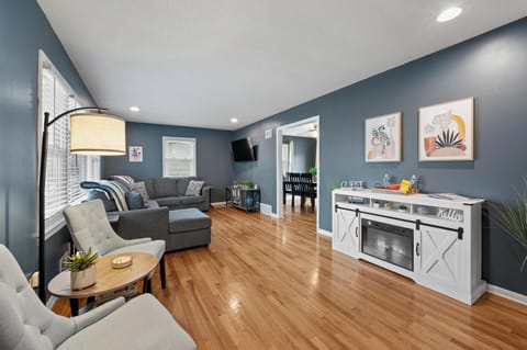 A warm and inviting living room featuring a cozy reading nook with two comfortab
