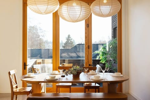 A bright, light-filled dining area perfect for morning coffee or group dinners.