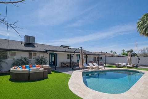 Private backyard oasis with FREE heater pool, lounge seating, and outdoor dining area, fire pit lounge
