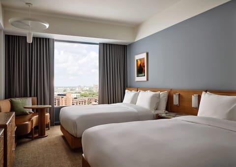 Wake up to skyline views from crisp, cloud-soft beds.