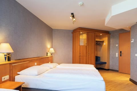 Unwind in a bright, spacious room with warm wood accents