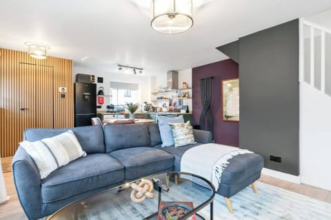 A bright and inviting living room designed for comfort and relaxation. Featuring cozy seating and a welcoming atmosphere, it’s the perfect place to unwind after a long day, enjoy a movie, or spend quality time with family and friends.