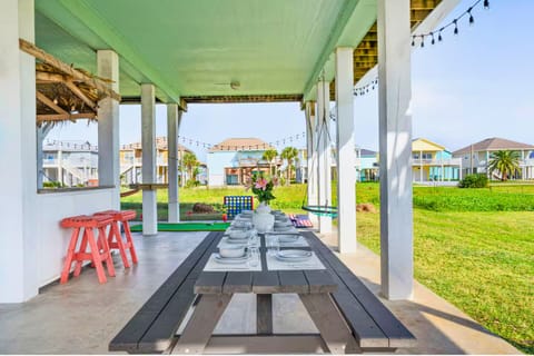 Salt Air & Sunset Views. 🍹 Step out onto the deck for a breath of fresh air. Whether you’re grilling, lounging, or gathering around the fire pit, this is where the best vacation memories are made.