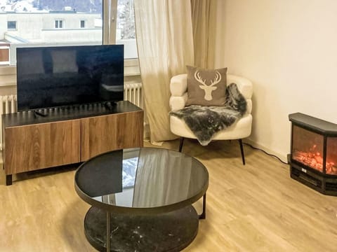 Furniture, Flooring, Interior Design, Wood, Floor, Television, Wood Flooring, Room, Living Room, Lighting