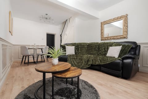 A stylish living area with a Smart TV and Netflix comfortable sofa and separate sofa bed, and ultra-fast 600/900Mbps WiFi. Bright, modern, and perfect for relaxing, streaming, or working comfortably.