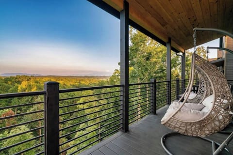 Unwind in your hanging chair while soaking in breathtaking autumn views from your private balcony.