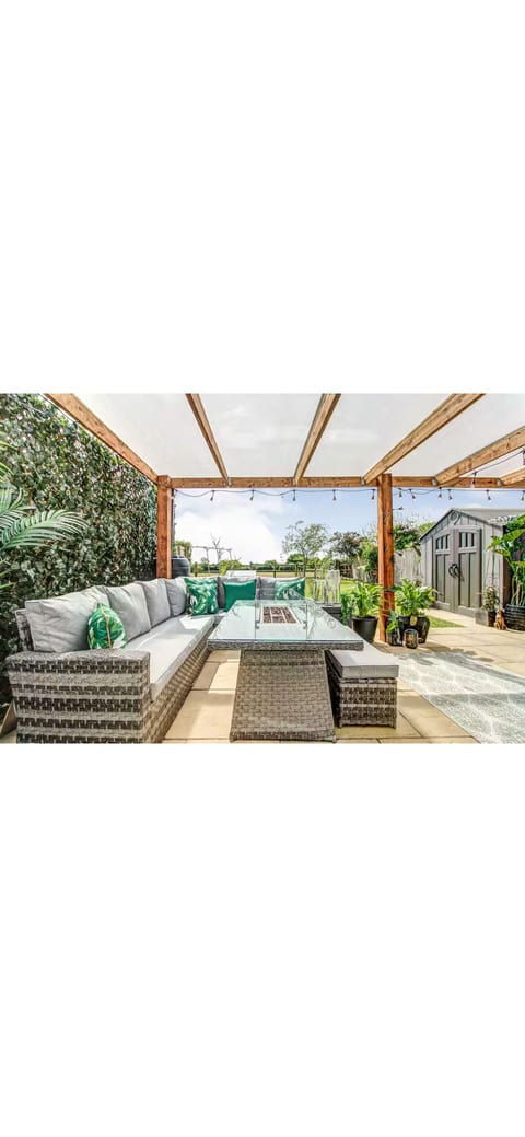 kick back and relax in the sun with your favorite beverage on the south facing private patio area with built in table fire pit