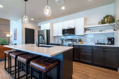 Spacious chef’s kitchen with large island and modern finishes.