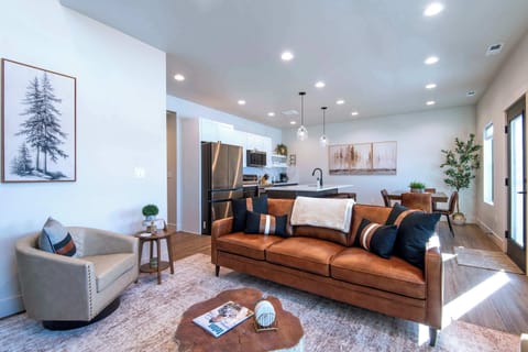 Open-concept living space connecting seamlessly to kitchen and dining.