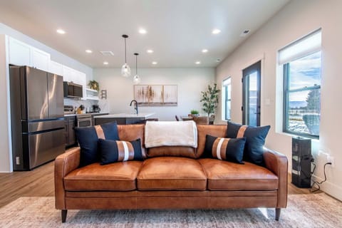 Open-concept living space connecting seamlessly to kitchen and dining.