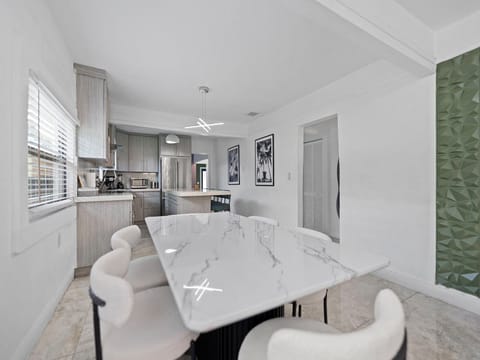 Modern open-concept kitchen with large dining table