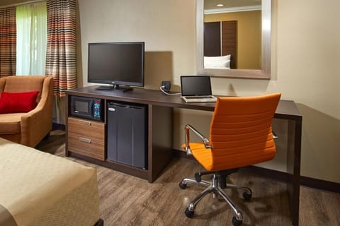 Settle in and stay productive with desk, TV, and snacks.