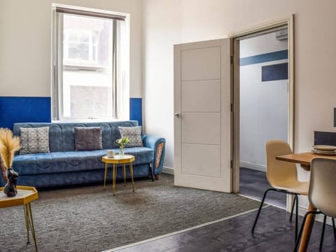 Spend time together in the open living space with sofa seating and a dining area.