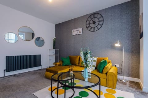 The living room seating area is arranged around the coffee table for group use.