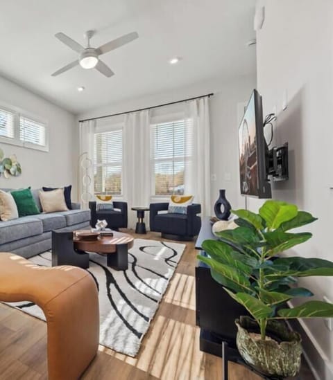 The Sunrise | Hazy Collection — Bright, stylish Atlanta tiwnhome near Grant Park & Zoo Atlanta. Enjoy a sun-filled living space, modern design, garage parking and a community pool access, perfect for extended stays, relocations, & comfortable city living.