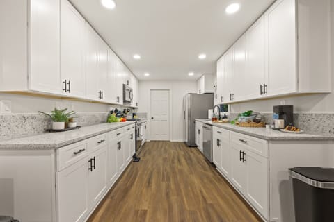 Step into your spacious kitchen - fully stocked with stainless steel appliances.