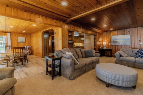 Living Room - Also shows the dining room and kitchen. There's a door to the side yard off the kitchen.