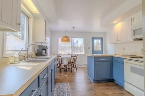 Kitchen - Entry to the main dining room and living room is to the right of the blue door