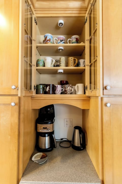 Kitchen - Coffee station and coffee cups.