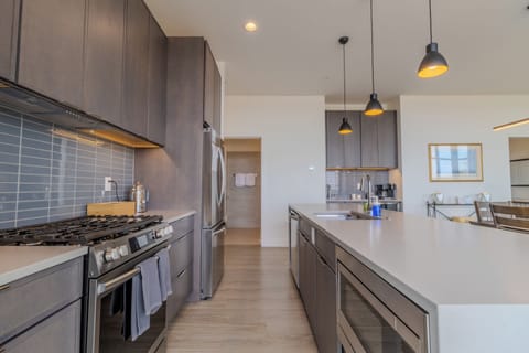 Lower Level - Kitchen - Well equipped full kitchen. Shown also is the entry to the main 3/4 bathroom and the wet bar and coffee station.