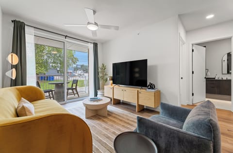 Stretch out in the inviting living room with a pull-out sofa, oversized TV, and modern design touches throughout.