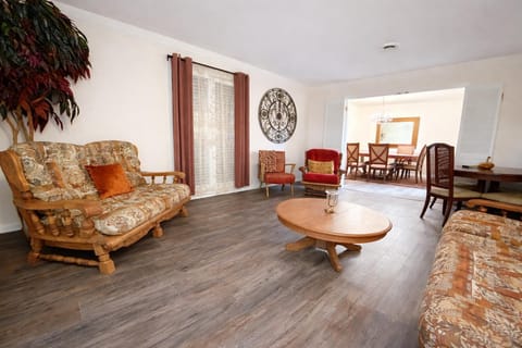 Spacious living area with plush seating and natural light — the ideal spot for families and groups to relax