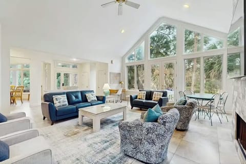 Relax in your bright, airy living space with soaring ceilings and floor-to-ceiling windows that flood the room with natural light.