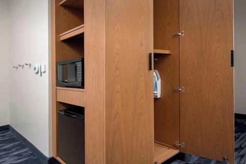 Grab snacks anytime with microwave and convenient mini-fridge.