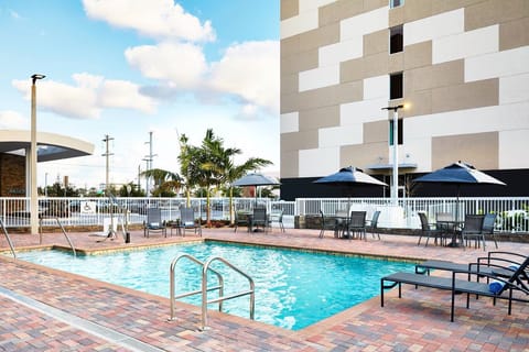 Dive into sunshine and unwind on poolside loungers.