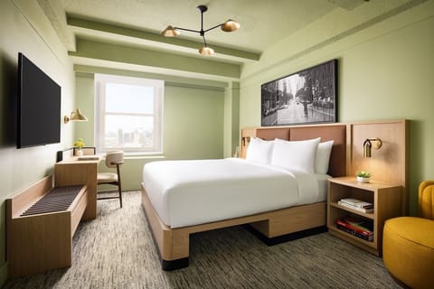 Settle into a serene room with skyline views and plush bed.