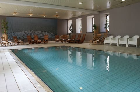 Unwind poolside with comfortable loungers and peaceful ambiance.