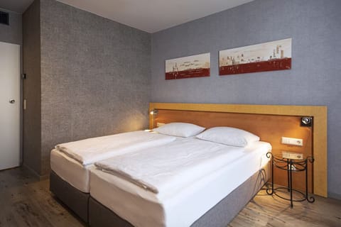 Unwind in crisp twin beds after a busy day.