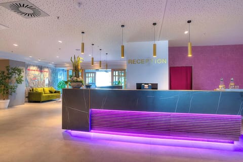 Arrive with ease at the stylish reception desk, warmly welcoming.