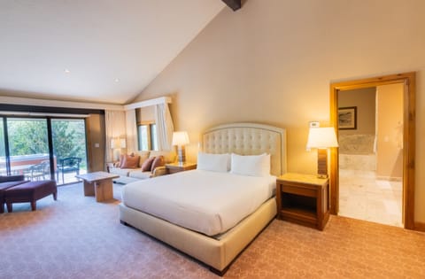Wake up to patio views from a serene, airy bedroom.