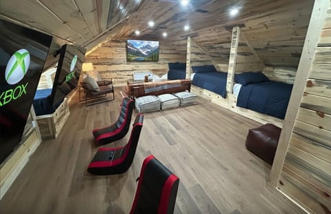 Upstairs kids room with 3 TV's and 2 XBoxes