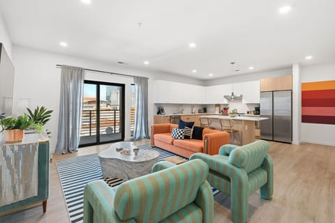 Living area with Smart TV and balcony access