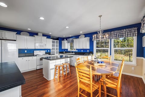 Bright coastal kitchen with a large island featuring bar seating, perfect for casual meals and conversation