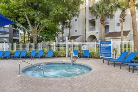 Float peacefully in crystal water surrounded by resort scenery.