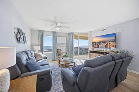 Spacious living room with comfortable seating and ocean views