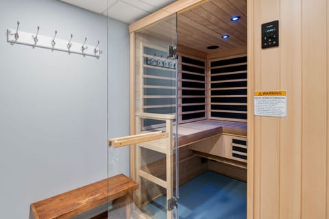 Game room with lounge, TV, ping pong/pool table & sauna.