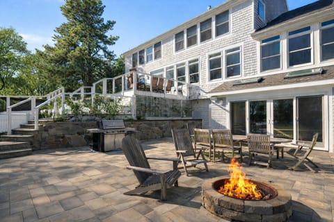 Patio area with grill, outdoor fireplace & dinning table for 8.