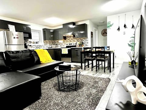 Living room with super comfortable leather sofa bed, LG Television with over 2000 channels. 