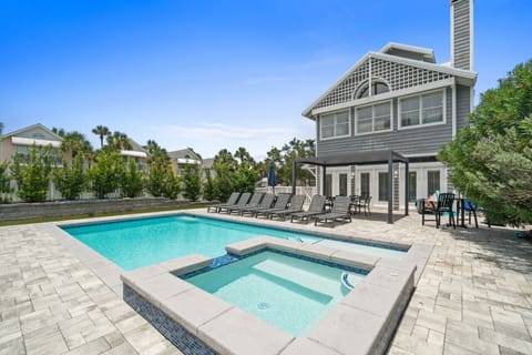 Beautiful home with large luxury pool and spa.  Plenty of outdoor space with shade pergola, lounge chairs, dining areas and gas grill.