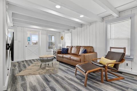 Style meets comfort in this professionally designed lounge. Featuring mid-century modern furniture and local artwork
