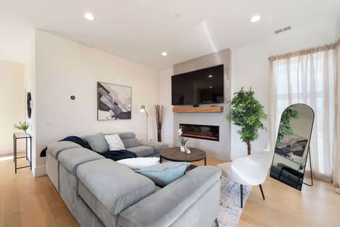 Calm bedroom retreat w/ soft light, cozy bedding, & a peaceful, uncluttered feel.