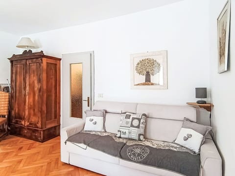 Furniture, Interior Design, Flooring, Couch, Wall, Floor, Wood, Room, Living Room, Lighting